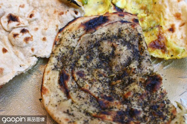 mint paratha, tandoori roti and stuffed naan bread closeup
